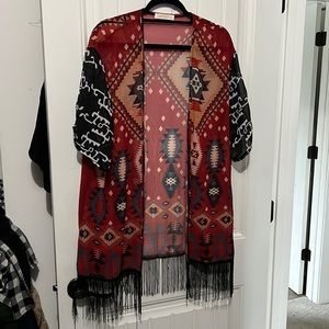 Women’s short kimono with fringe.
